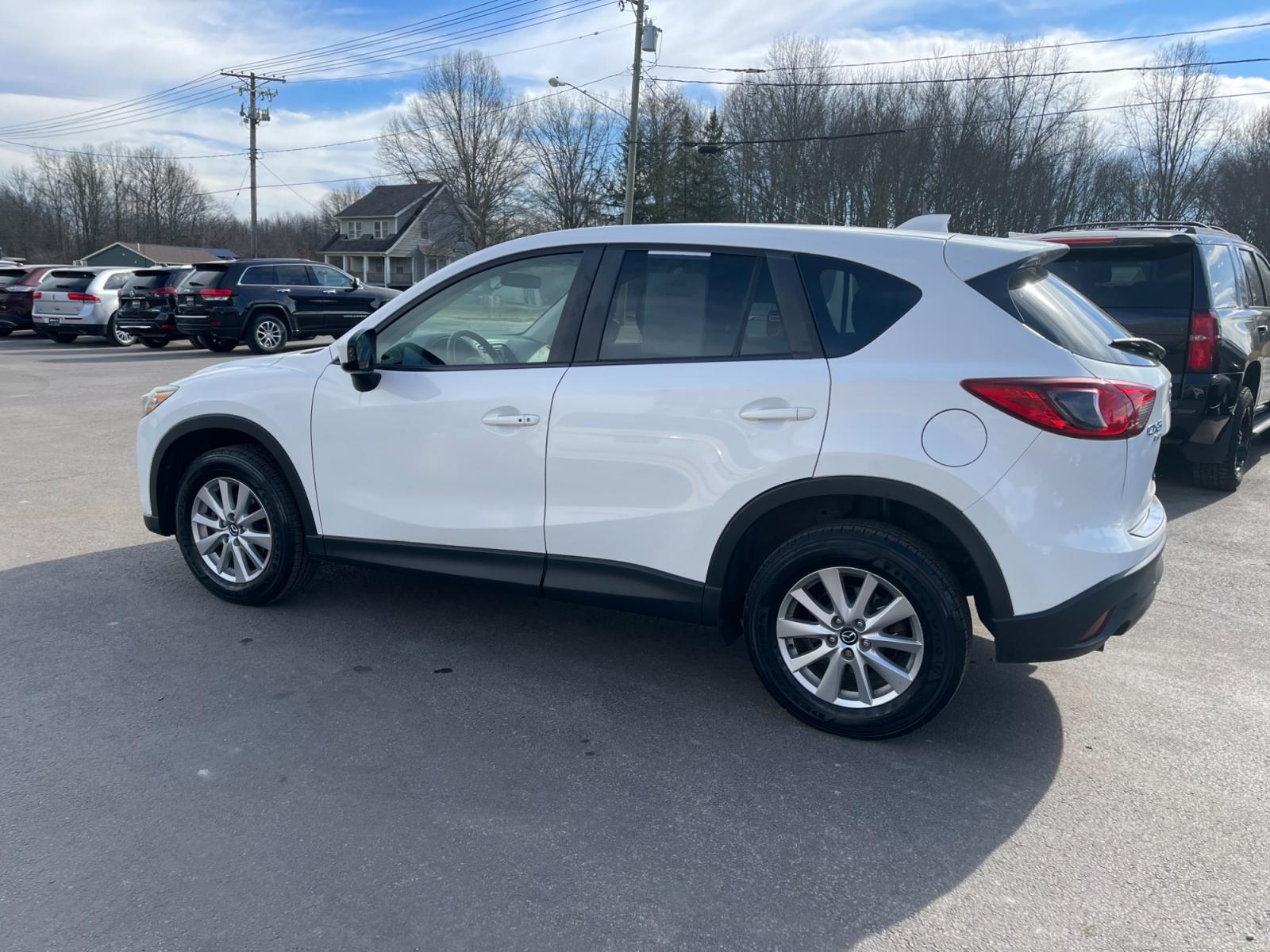 2015 White /Black Mazda CX-5 Touring AWD (JM3KE4CYXF0) with an 2.5L I4 DOHC 16V engine, 6-Speed Automatic transmission, located at 547 E. Main St., Orwell, OH, 44076, (440) 437-5893, 41.535435, -80.847855 - This 2015 Mazda CX-5 Touring AWD is a well-equipped SUV that offers a blend of performance, safety, and convenience for its drivers. Being a one-owner vehicle as per its Carfax report signifies well-attended maintenance and care. It is loaded with advanced features such as Blind Spot Monitoring and - Photo #13